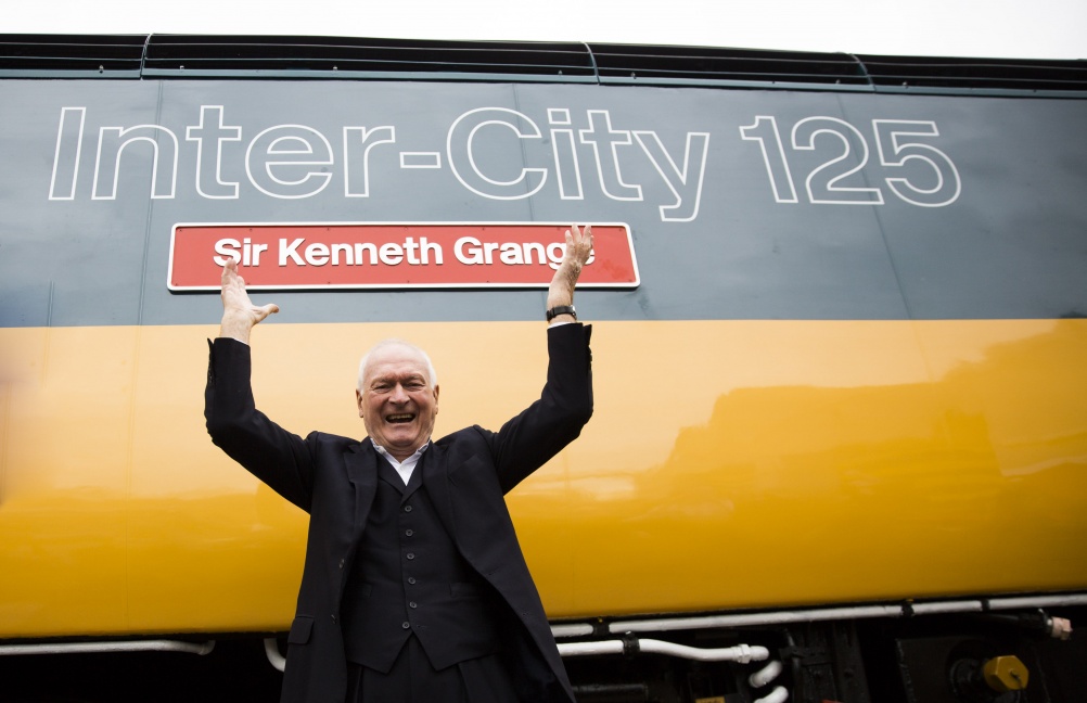 Sir Kenneth Grange in front of the Inter-City 125 train named after him